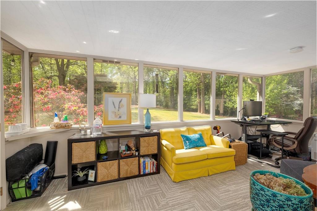 2282 Marthasville Court Smoke Rise, GA 30087 - Photo 19 of 48 a living room with furniture and a large window