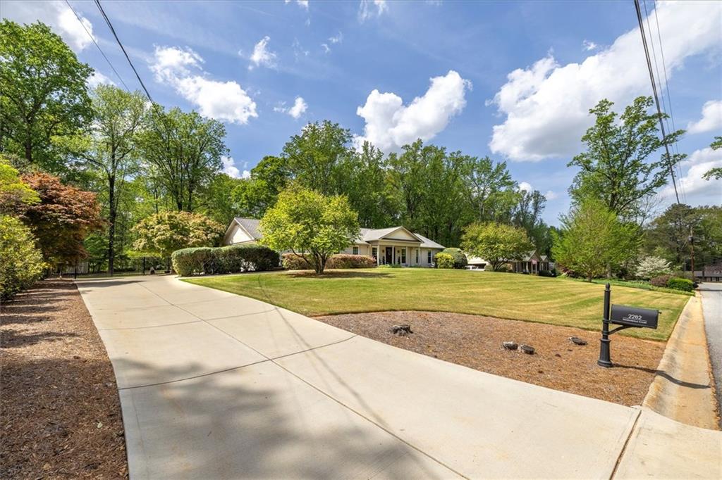 2282 Marthasville Court Smoke Rise, GA 30087 - Photo 2 of 48 a view of a yard with a fountain