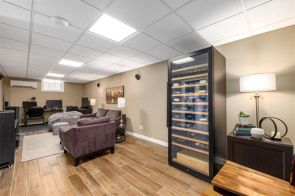 2282 Marthasville Court Smoke Rise, GA 30087 - Photo 30 of 48 a living room with furniture and wooden floor