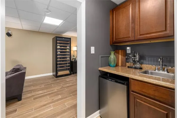 a kitchen with granite countertop a sink and cabinets