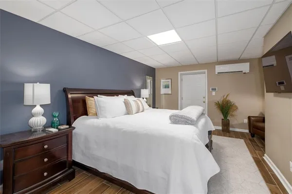 a bedroom with bed and window