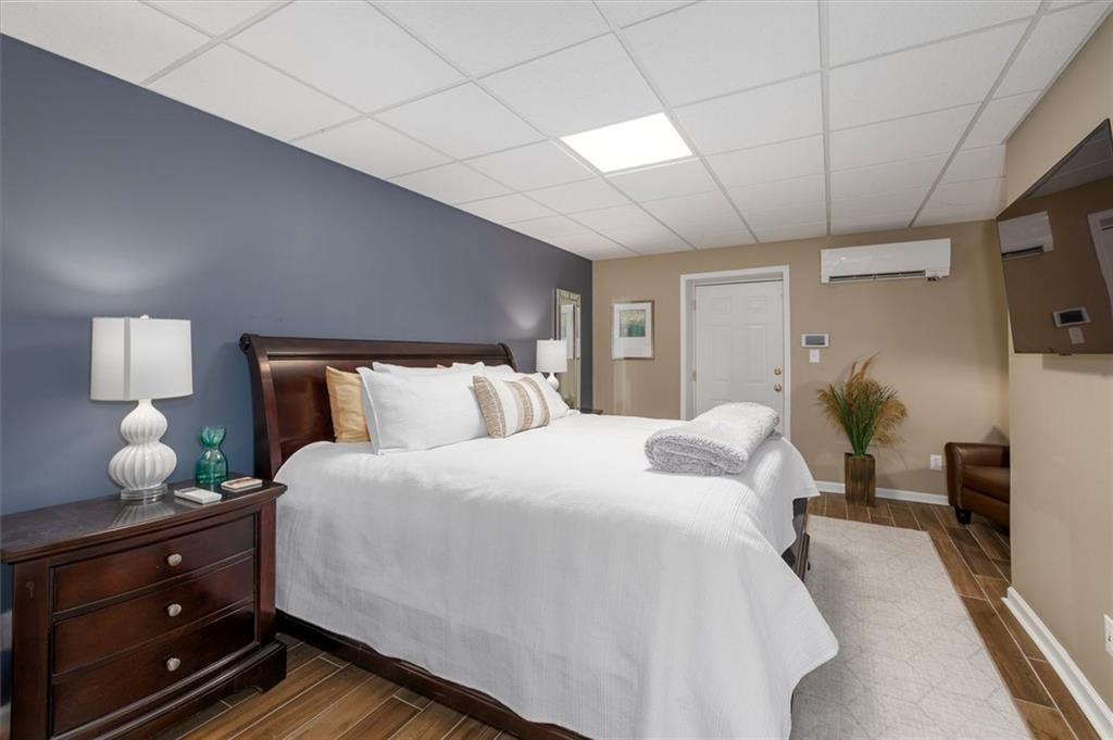 2282 Marthasville Court Smoke Rise, GA 30087 - Photo 34 of 48 a bedroom with bed and window