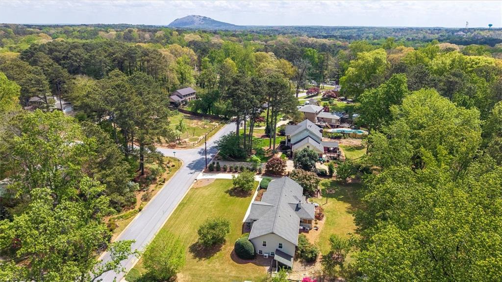 2282 Marthasville Court Smoke Rise, GA 30087 - Photo 37 of 48 a aerial view of lake and residential houses with outdoor space