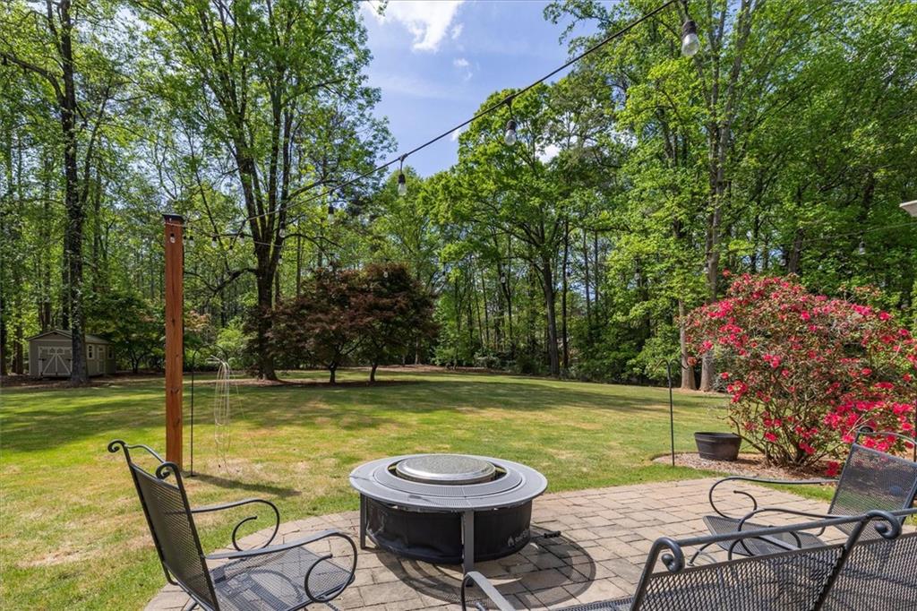 2282 Marthasville Court Smoke Rise, GA 30087 - Photo 41 of 48 a view of a swimming pool with a lounge chair