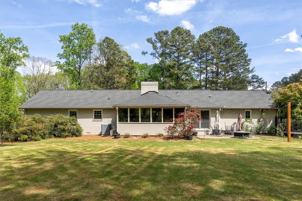 2282 Marthasville Court Smoke Rise, GA 30087 - Photo 43 of 48 a front view of a house with garden