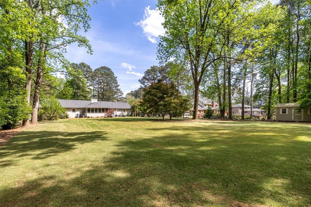 2282 Marthasville Court Smoke Rise, GA 30087 - Photo 44 of 48 a front view of a house with a garden