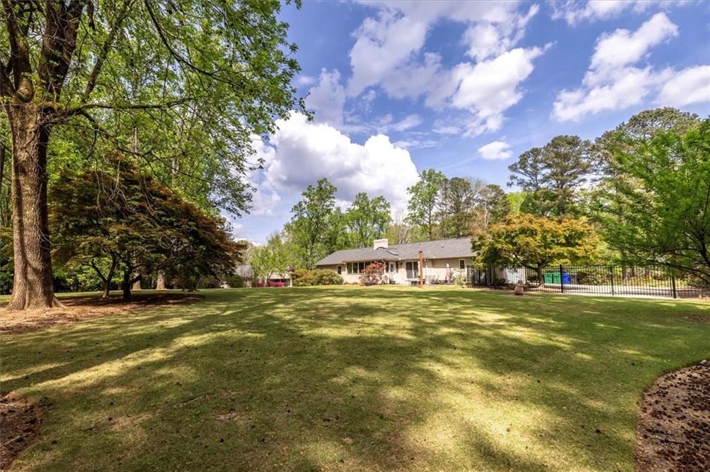 2282 Marthasville Court Smoke Rise, GA 30087 - Photo 46 of 48 a front view of a house with a garden