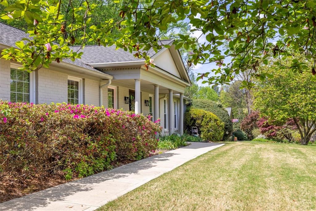 2282 Marthasville Court Smoke Rise, GA 30087 - Photo 5 of 48 a front view of a house with a garden
