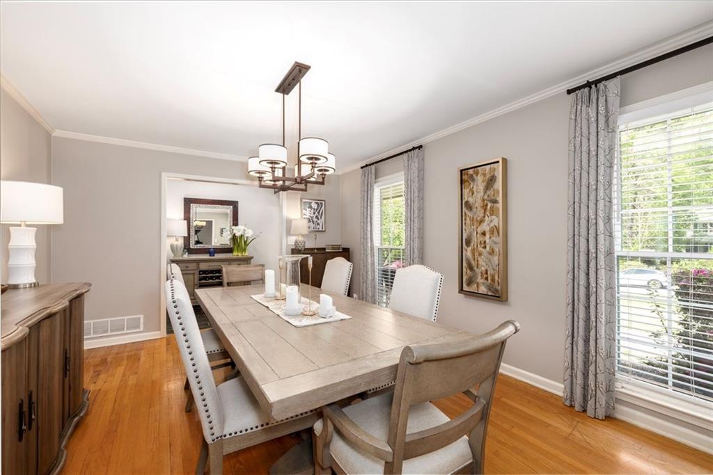 2282 Marthasville Court Smoke Rise, GA 30087 - Photo 10 of 48 a view of a dining room with furniture window and wooden floor