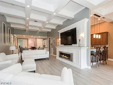 a living room with fireplace furniture and a flat screen tv