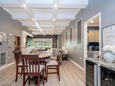 a dining room with furniture and wooden floor
