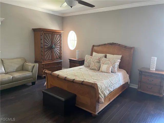 a bedroom with a bed couch and window