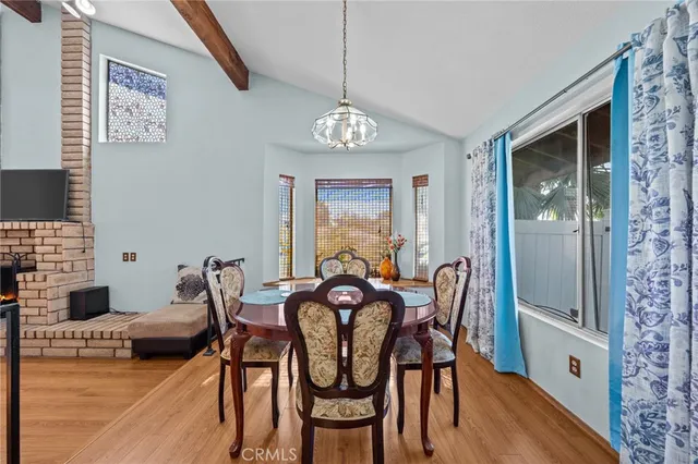 a dining room with furniture and window