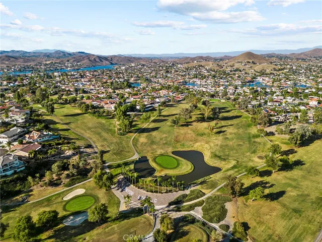 a view of a building with car parked
