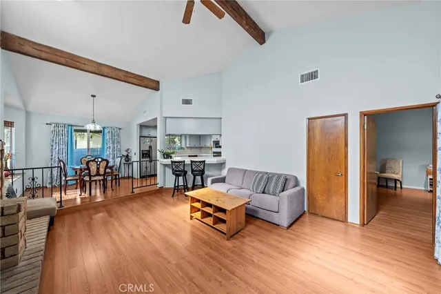 a living room with fireplace furniture and a wooden floor