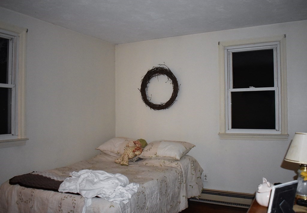 1702 State Road Plymouth, MA 02360 - Photo 11 of 17 a bedroom with a bed and a window