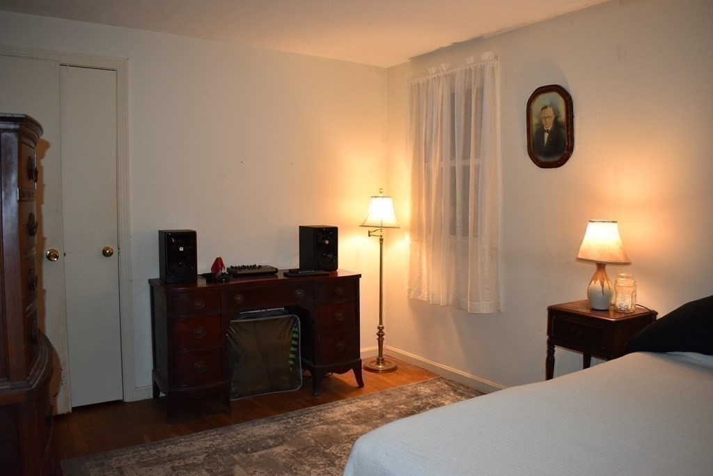 1702 State Road Plymouth, MA 02360 - Photo 13 of 17 a bedroom with furniture and a window