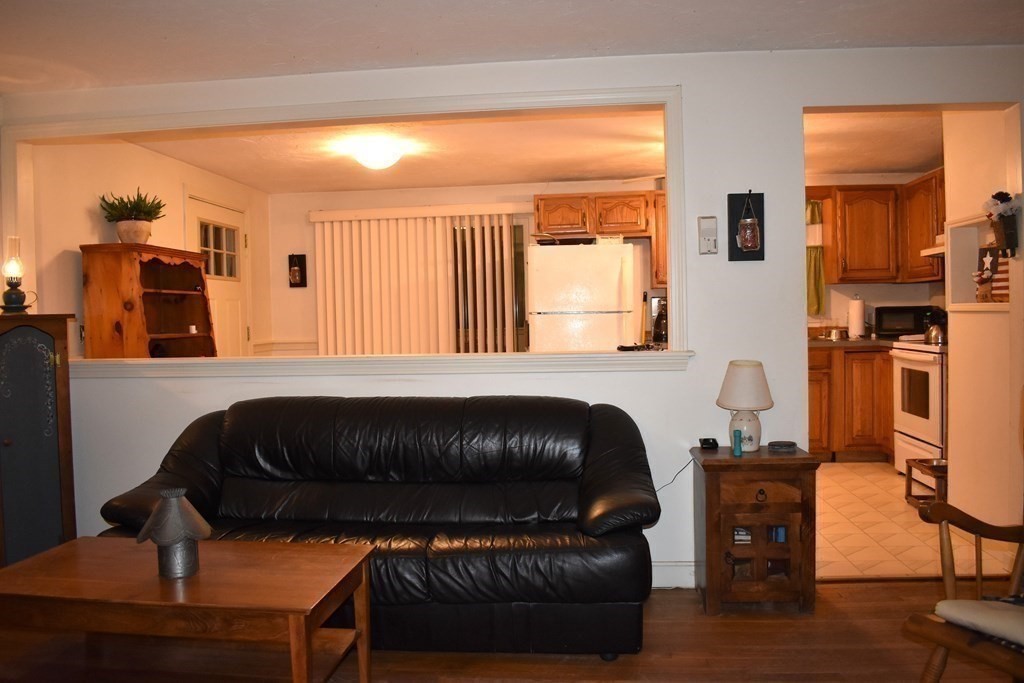 1702 State Road Plymouth, MA 02360 - Photo 5 of 17 a bedroom with a bed and wooden floor