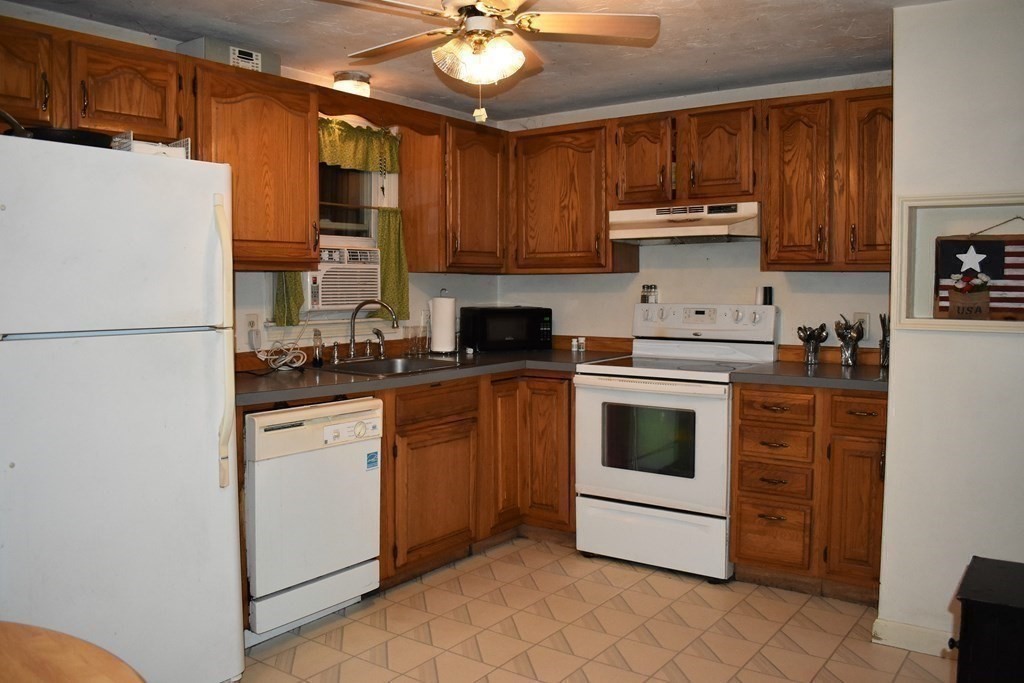 1702 State Road Plymouth, MA 02360 - Photo 8 of 17 a kitchen with cabinets stainless steel appliances and a counter space
