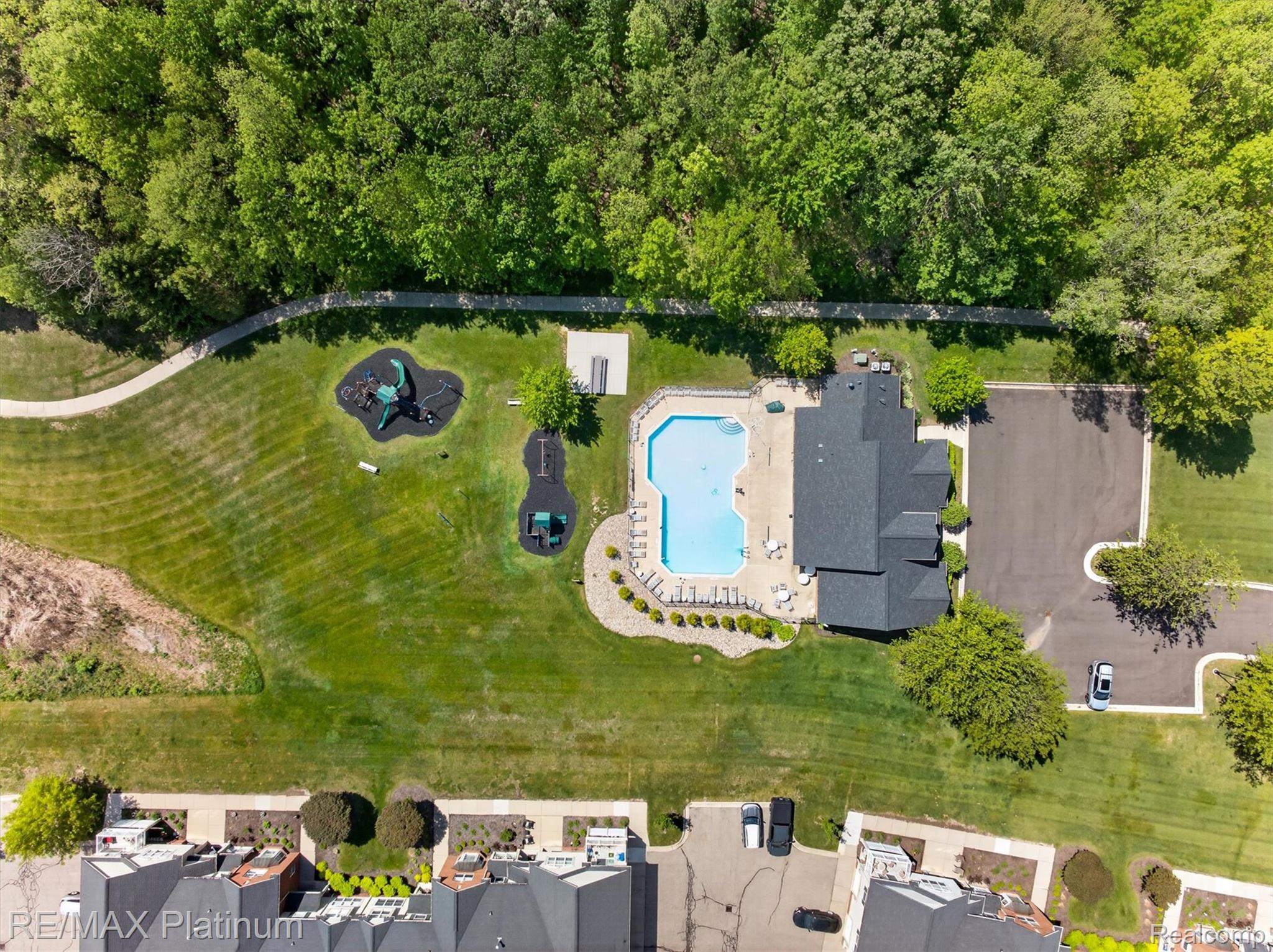 4191 Hampton Ridge Boulevard, Unit 41 Howell, MI 48843 - Photo 21 of 23 Aerial view of a pool