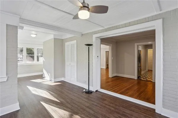 wooden floor in an empty room with a window