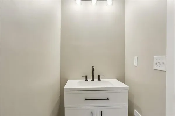 a bathroom with a sink and a vanity