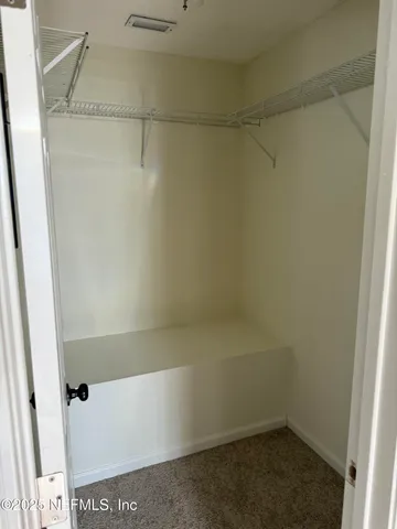 a view of small space with racks on the wall