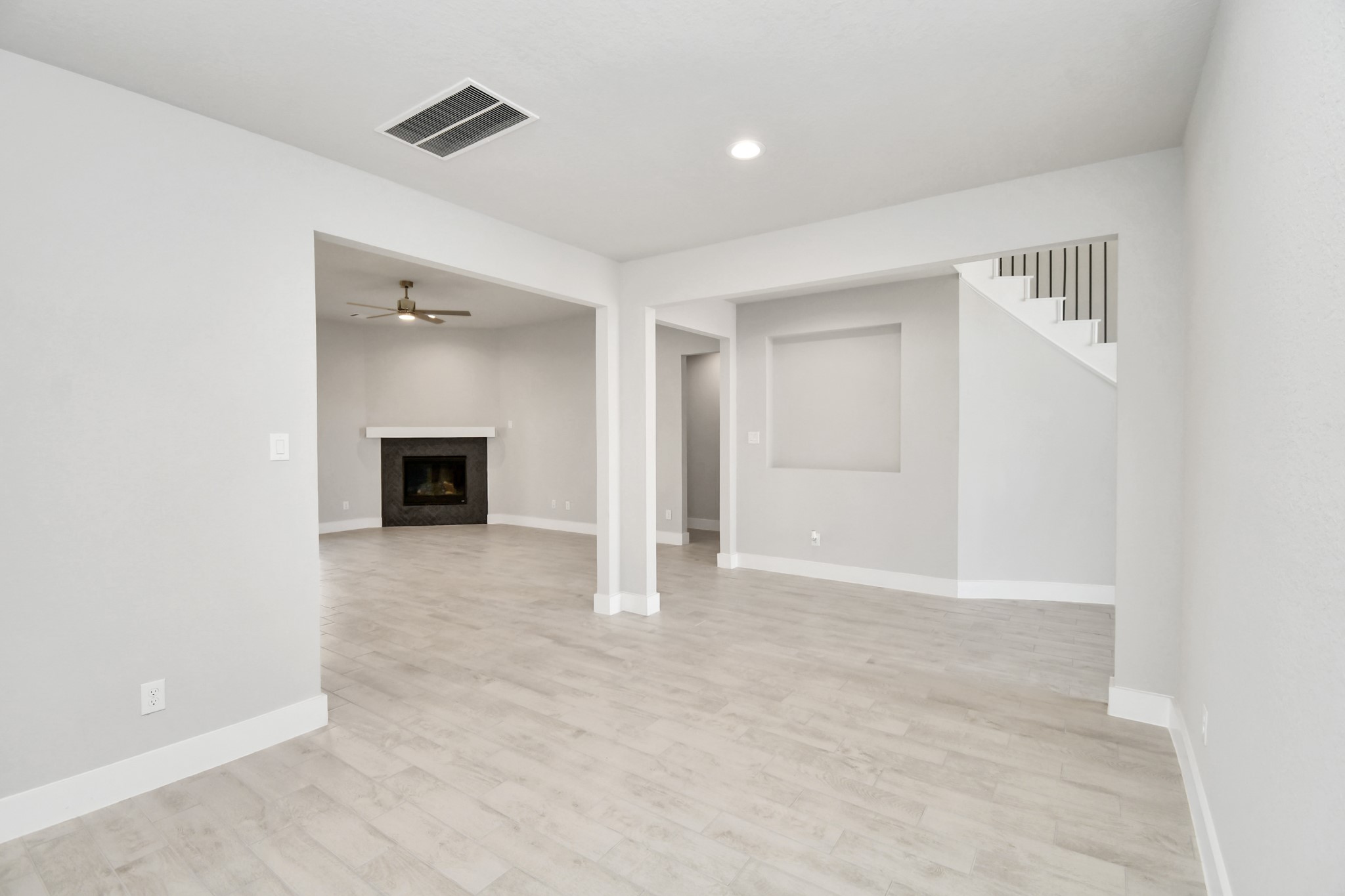 3106 Native Spg Drive Spring, TX 77373 - Photo 10 of 38 Create lasting memories with your family and friends at the dining table! This expansive dining room showcases sophisticated flooring, custom paint, and seamlessly connects to the family room and kitchen, providing an open and inviting atmosphere. Sample photo of completed home with similar floor plan. Actual colors and selections may vary.