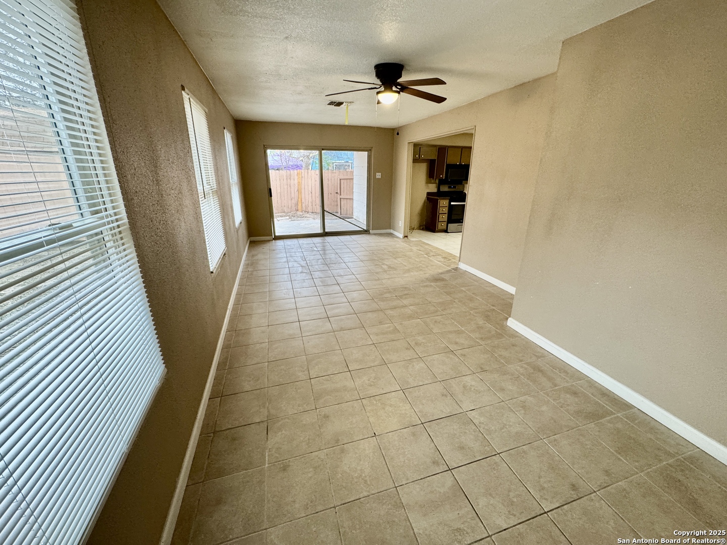 146 Stapleton Street San Antonio, TX 78227 - Photo 11 of 28 a view of hallway with a window and a chandelier