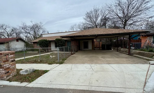 a view of house with yard