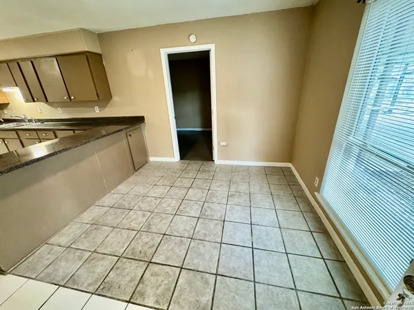 a view of a livingroom with an empty space and a sink