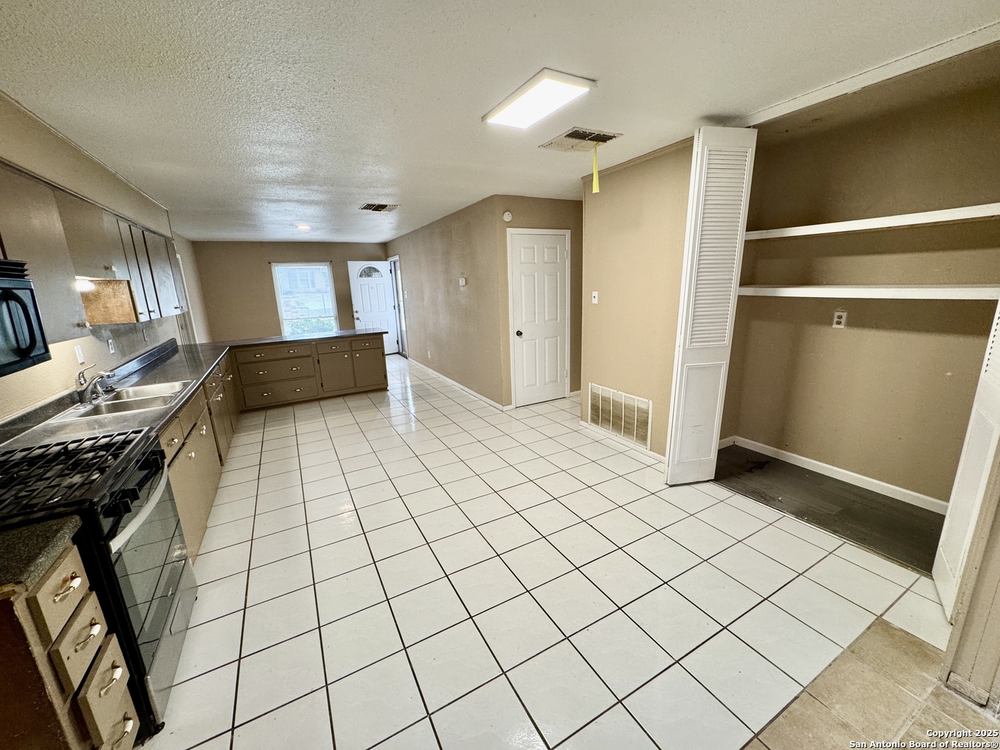 146 Stapleton Street San Antonio, TX 78227 - Photo 9 of 28 a view of a livingroom with wooden floor and furniture