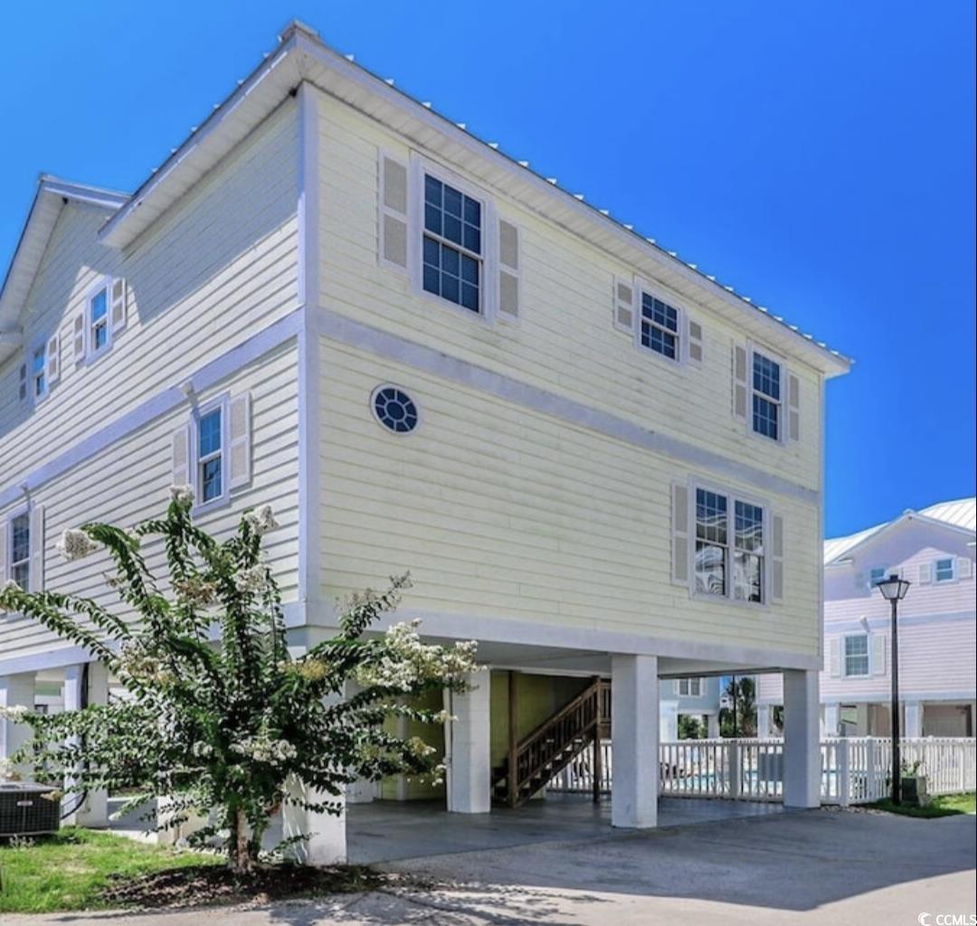 511 Caribbean Way Myrtle Beach, SC 29577 - Photo 2 of 17 View of property exterior featuring central air condition unit