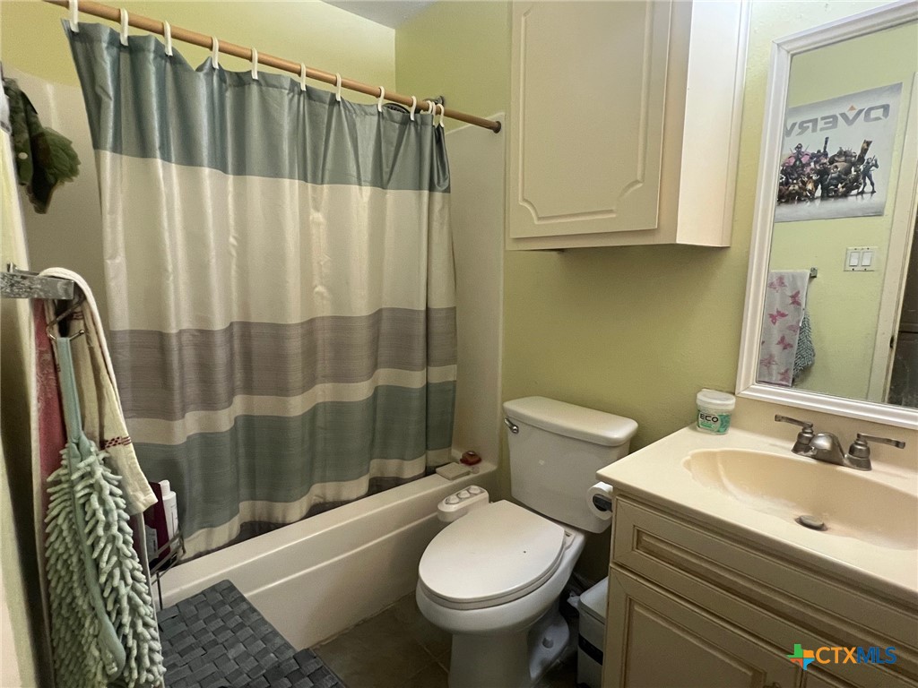 114 Chevy Chase Street Port Lavaca, TX 77979 - Photo 6 of 11 a bathroom with a sink toilet and shower