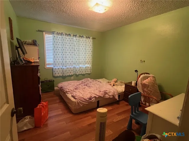 a bedroom with a bed and furniture