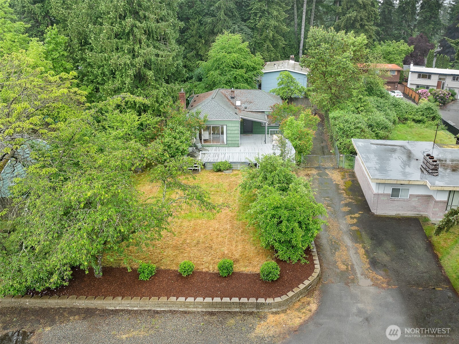 17633 10th Avenue Northeast Shoreline, WA 98155 - Photo 30 of 33 a view of a house with a yard