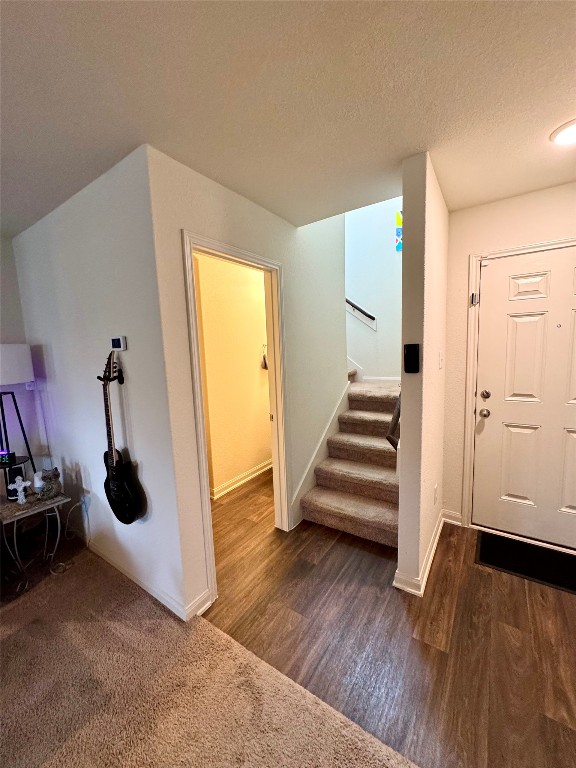 205 Denson Lane, Unit 8D Jarrell, TX 76537 - Photo 11 of 29 an empty room with wooden floor and white walls