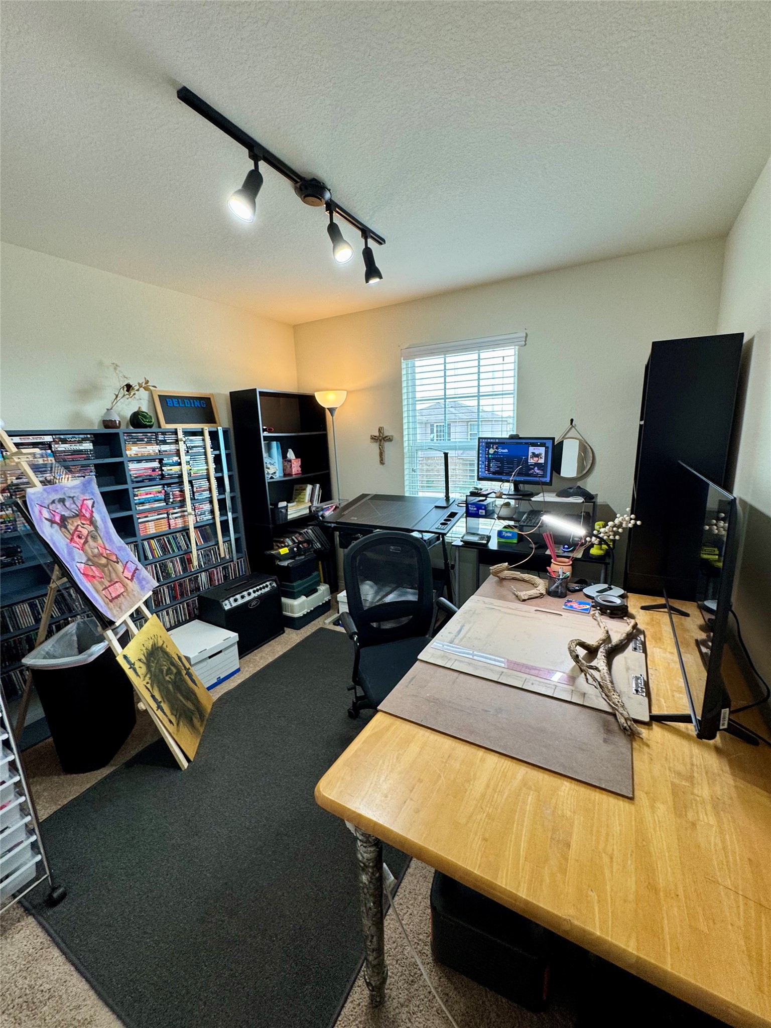 205 Denson Lane, Unit 8D Jarrell, TX 76537 - Photo 12 of 29 a room with furniture and a flat screen tv