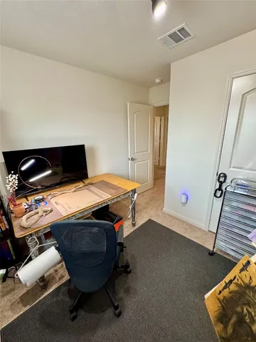 a room with furniture pool table and a flat screen tv