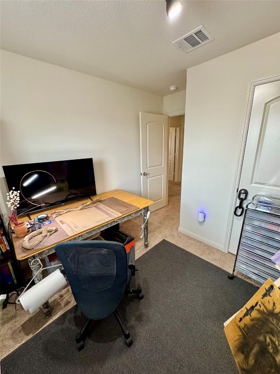 205 Denson Lane, Unit 8D Jarrell, TX 76537 - Photo 13 of 29 a bedroom with a bed and a dresser