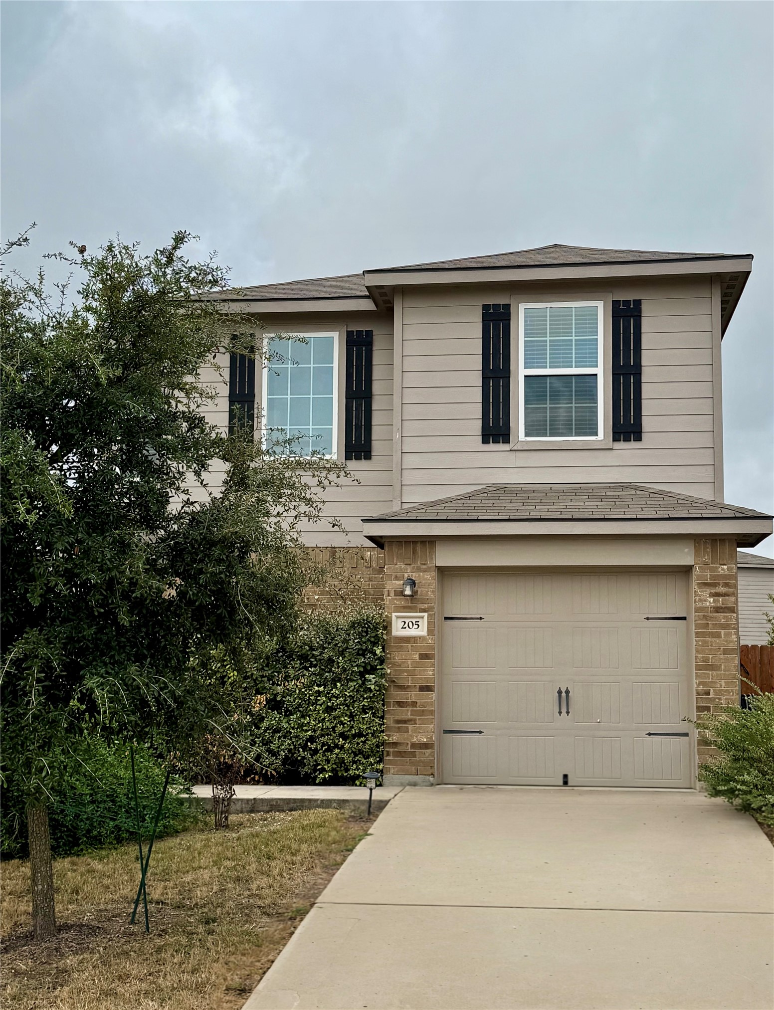 205 Denson Lane, Unit 8D Jarrell, TX 76537 - Photo 2 of 29 a front view of house with yard