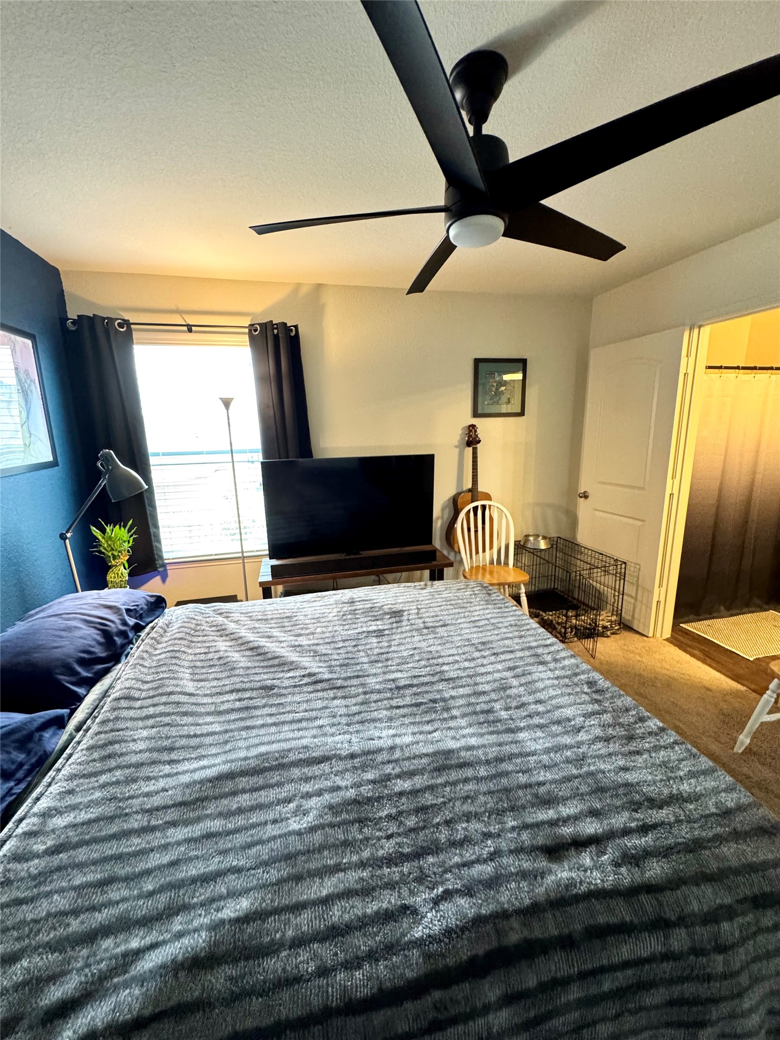 205 Denson Lane, Unit 8D Jarrell, TX 76537 - Photo 20 of 29 a bedroom with a bed and a mirror