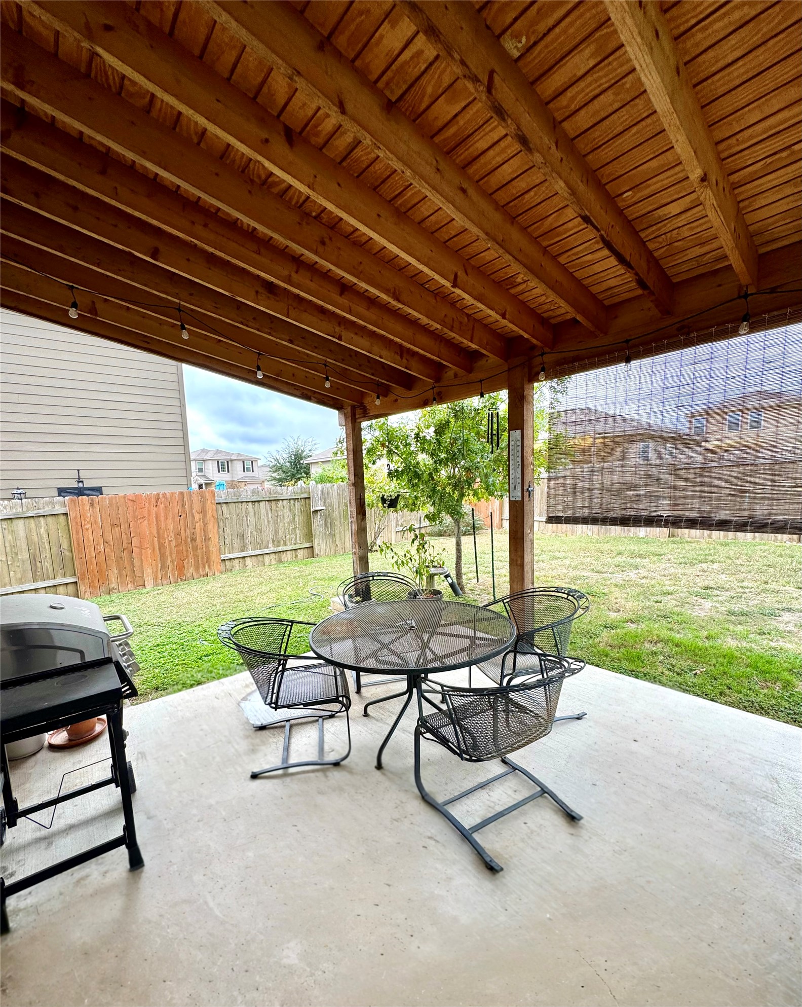 205 Denson Lane, Unit 8D Jarrell, TX 76537 - Photo 25 of 29 a view of a patio with a table chairs and a patio