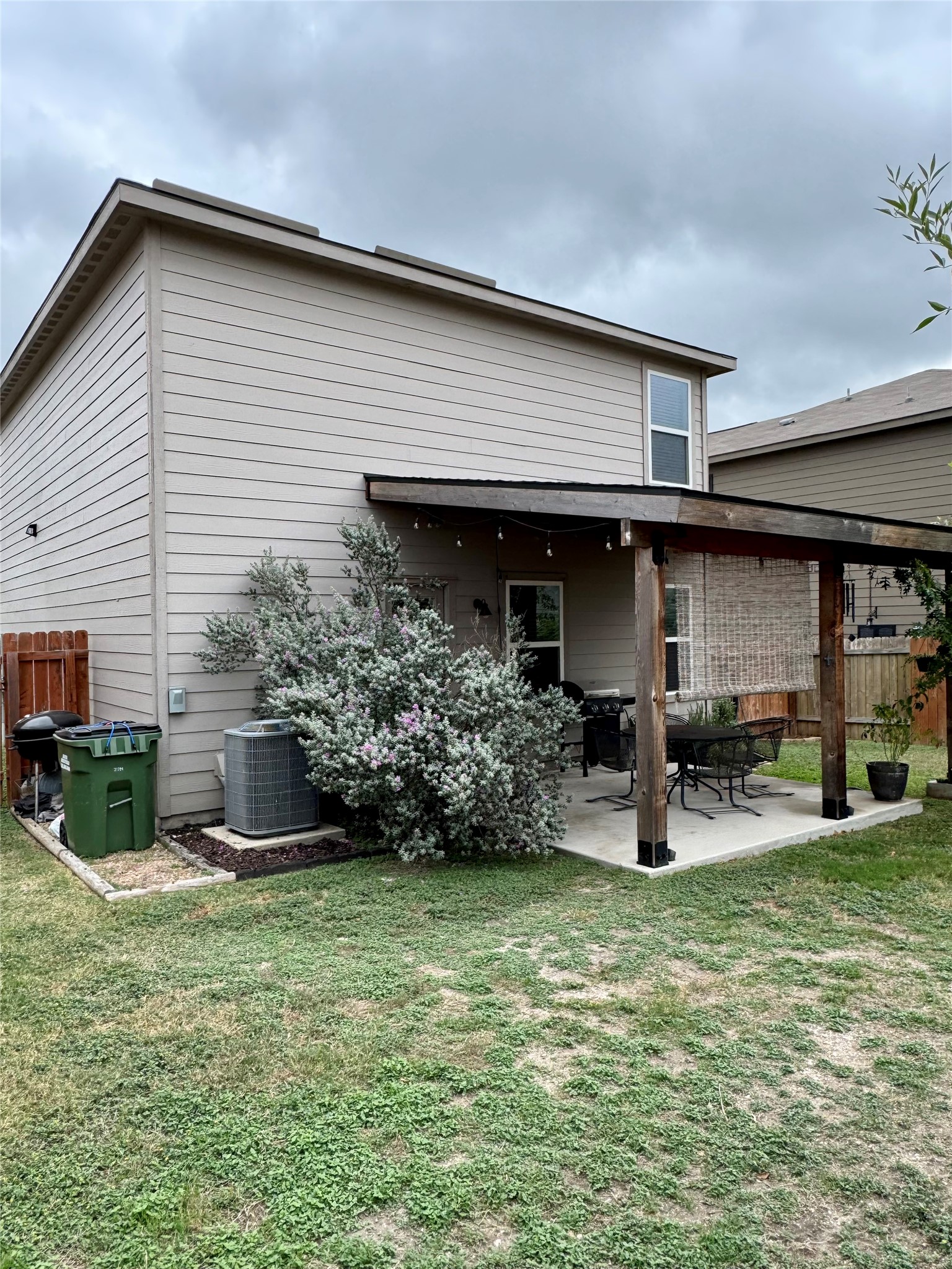 205 Denson Lane, Unit 8D Jarrell, TX 76537 - Photo 28 of 29 a front view of house with a garden