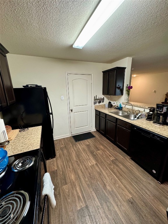 205 Denson Lane, Unit 8D Jarrell, TX 76537 - Photo 8 of 29 a kitchen with a sink and a stove top oven