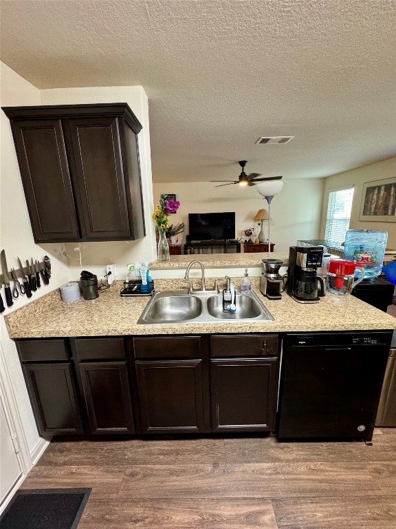 205 Denson Lane, Unit 8D Jarrell, TX 76537 - Photo 29 of 29 a kitchen with granite countertop a sink and cabinets