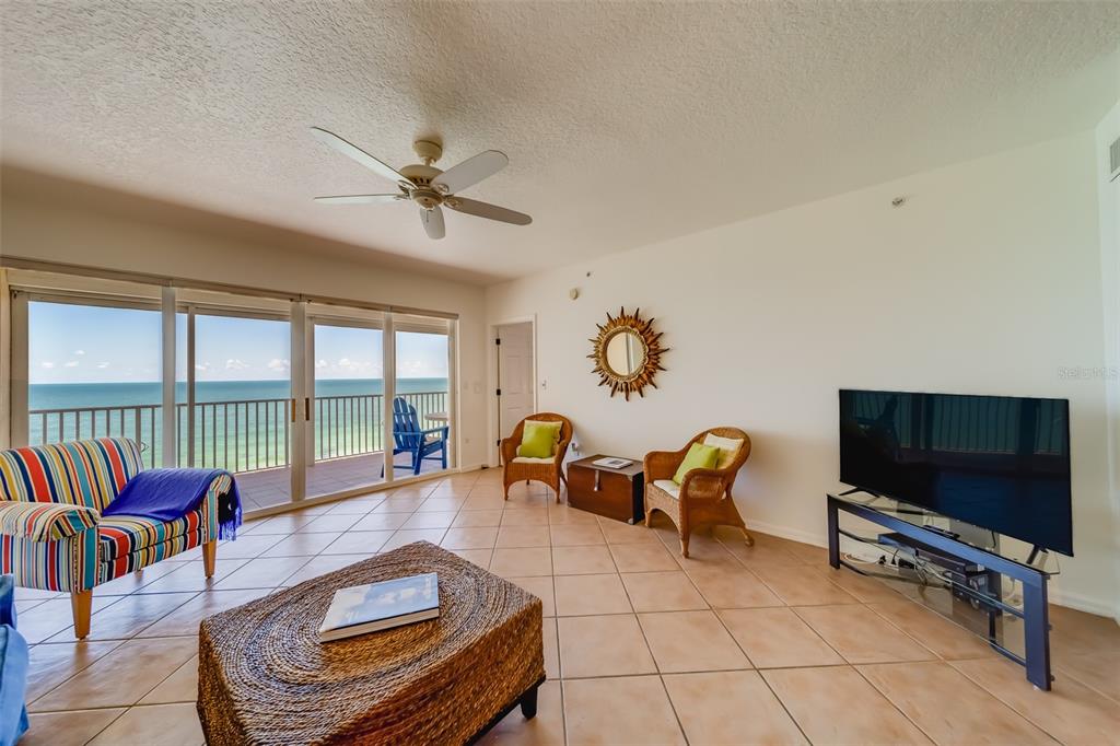 16550 Gulf Boulevard, Unit 643 North Redington Beach, FL 33708 - Photo 12 of 67 a living room with furniture and a flat screen tv