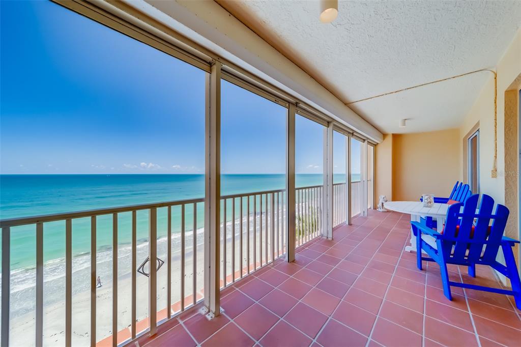 16550 Gulf Boulevard, Unit 643 North Redington Beach, FL 33708 - Photo 13 of 67 a balcony with furniture and wooden floor