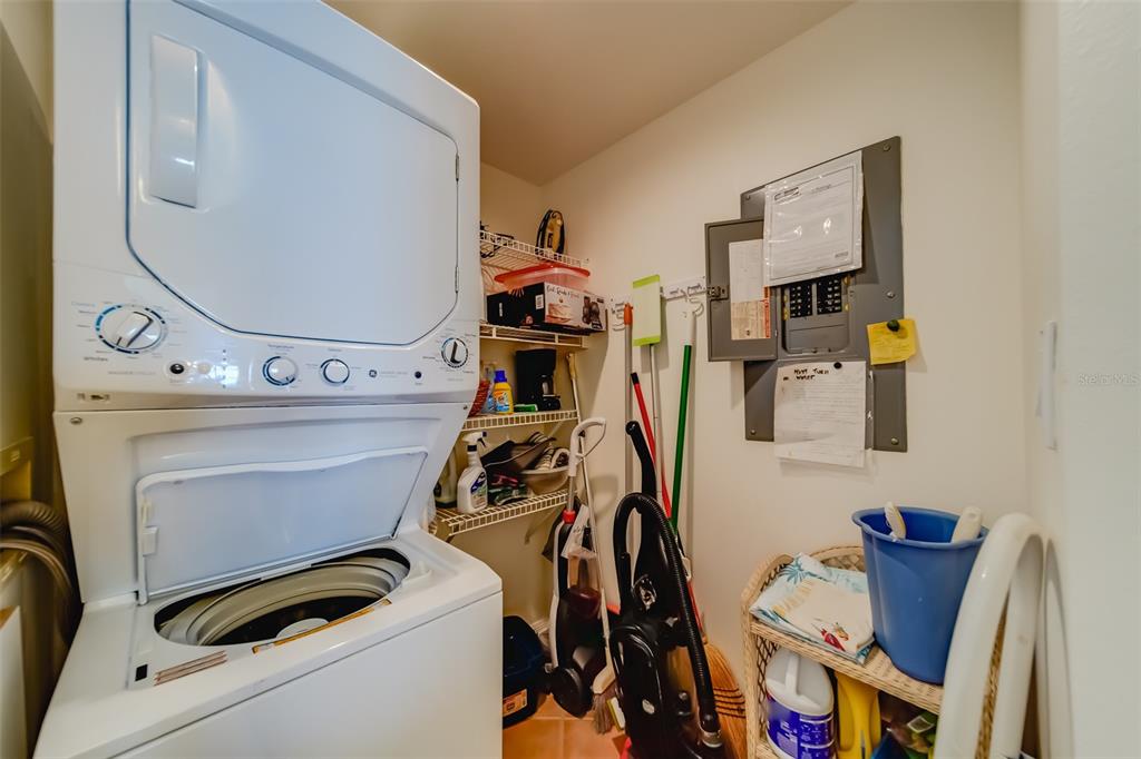 16550 Gulf Boulevard, Unit 643 North Redington Beach, FL 33708 - Photo 20 of 67 a view of storage and utility room with washer and dryer