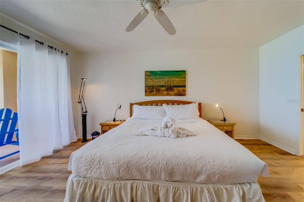 16550 Gulf Boulevard, Unit 643 North Redington Beach, FL 33708 - Photo 29 of 67 a bedroom with a bed and painting on the wall